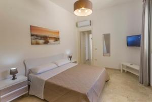 A bed or beds in a room at La Rosa Dei Venti