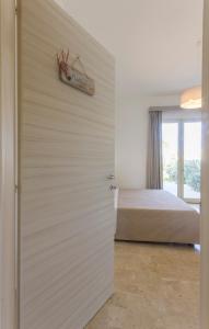 A bed or beds in a room at La Rosa Dei Venti