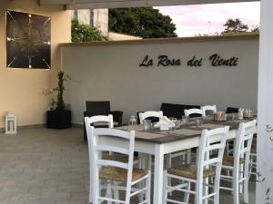 A restaurant or other place to eat at La Rosa Dei Venti