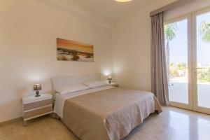 A bed or beds in a room at La Rosa Dei Venti