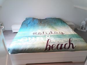 Ένα ή περισσότερα κρεβάτια σε δωμάτιο στο Duinhuis26