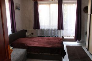 Postel nebo postele na pokoji v ubytování Ibolya Apartmanok