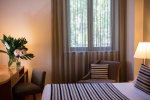 Postel nebo postele na pokoji v ubytování Hotel dei Duchi