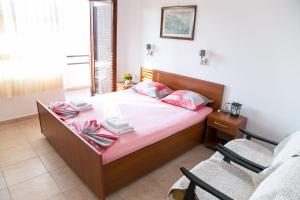 Postel nebo postele na pokoji v ubytování Apartments Aga