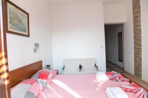 Postel nebo postele na pokoji v ubytování Apartments Aga