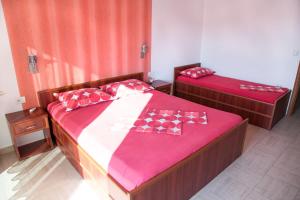 Postel nebo postele na pokoji v ubytování Apartments Aga