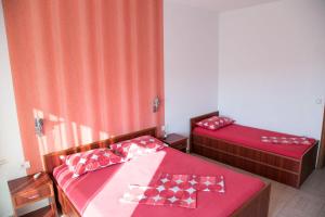 Postel nebo postele na pokoji v ubytování Apartments Aga