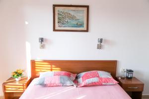 Postel nebo postele na pokoji v ubytování Apartments Aga