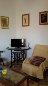 TV a/nebo společenská místnost v ubytování La casa de la acequia