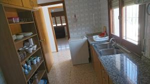 Kuchyň nebo kuchyňský kout v ubytování Vivienda vacacional "Beniarda" + 11 fotografií