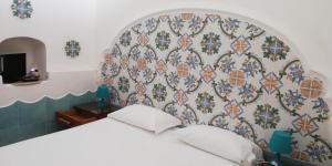 Postel nebo postele na pokoji v ubytování Hotel 4 Stagioni