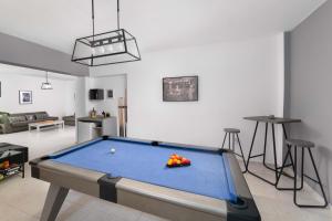 a living room with a pool table in it at Villa Bella with Private Pool and Hot Tub in Lartos