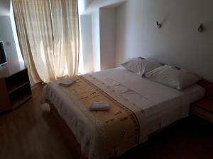 Posteľ alebo postele v izbe v ubytovaní Apartment Ivana