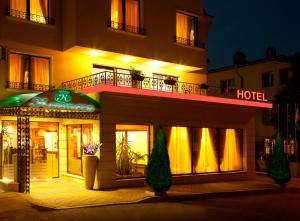 a hotel at night with a sign that reads hotel at Contessa Hotel in Shumen