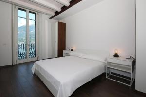 Postel nebo postele na pokoji v ubytování palazzo barindelli suite verde