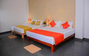 Postel nebo postele na pokoji v ubytování Hotel Star White - Negombo + 37 fotografií