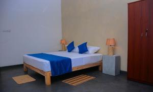 Postel nebo postele na pokoji v ubytování Hotel Star White - Negombo