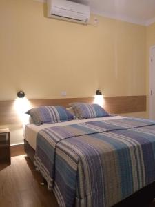 Cama ou camas em um quarto em Pousada Maresias Beira Mar