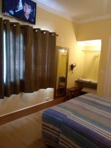 Cama ou camas em um quarto em Pousada Maresias Beira Mar