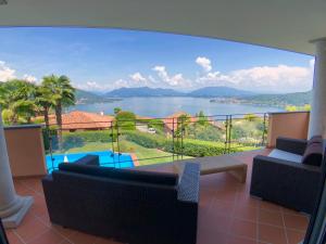 a living room with a view of the water at Villa Diamante in Meina