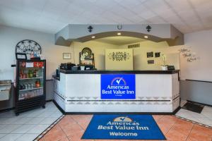an american best value inn restaurant with a counter at Americas Best Value Inn & Suites Williamstown in Williamstown