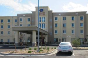 a car parked in front of a hotel at Comfort Suites Denver International Airport in Denver