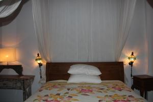 Postel nebo postele na pokoji v ubytování Ogek Home Stay