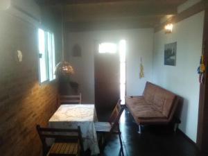 a living room with a couch and a table at Morro del Tesoro II in Punta del Este