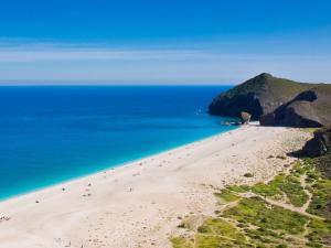 an aerial view of a beach with people on it at Hostal Asensio Nijar in Níjar +25 photos