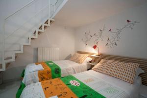 Postel nebo postele na pokoji v ubytování Guesthouse Da Giosuè