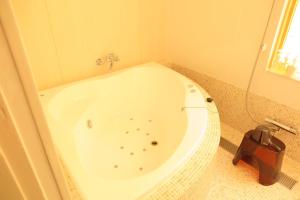 Salle de bains dans l'établissement OkutsuHotSpa IkedayaKajikaen
