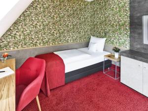 Postelja oz. postelje v sobi nastanitve Hirsch Hotel