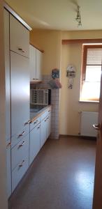 Kuchyň nebo kuchyňský kout v ubytování Gästehaus Karoline