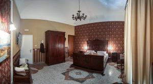 a bedroom with a large bed in a room at Palermo Gallery in Palermo