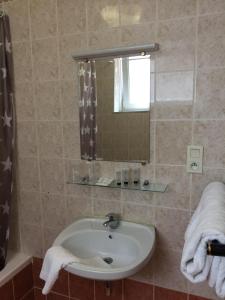 Ett badrum på Hotel Windsor
