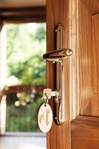 a lock on a wooden door with a key at Historic Boutique Hotel Maccarunera in Campagna