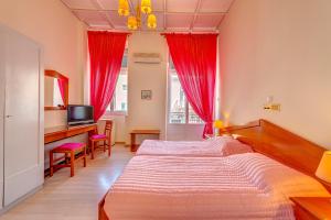 Uma cama ou camas num quarto em Hotel Halaris