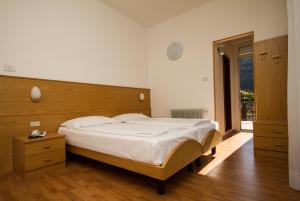 Un pat sau paturi într-o cameră la Villa Orchidea