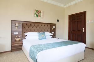 Кровать или кровати в номере Meryem's Hotel