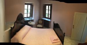 Postel nebo postele na pokoji v ubytování B&B Villa Tonelli