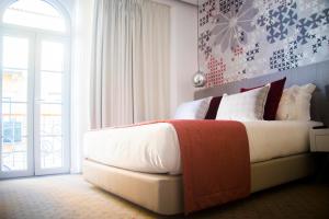 Cama ou camas em um quarto em Thomar Boutique Hotel