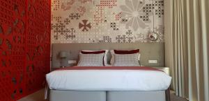 Cama ou camas em um quarto em Thomar Boutique Hotel