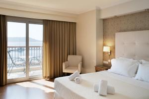 Postel nebo postele na pokoji v ubytování Karalis City Hotel + 37 fotografií