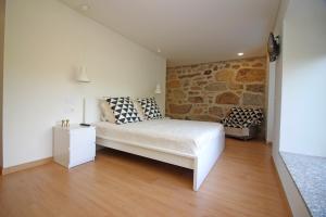 Postel nebo postele na pokoji v ubytování Casa Roupar by Gerês Casas + 44 fotografií