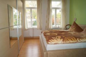 Ein Bett oder Betten in einem Zimmer der Unterkunft Ferienwohnung Schlossblick Altenburg