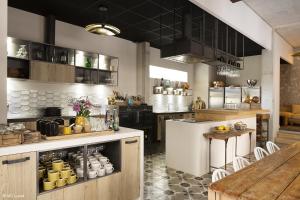 Кухня или мини-кухня в Le 19-21 - Un amour d'hotel
