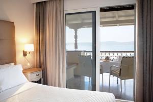 Postel nebo postele na pokoji v ubytování Karalis City Hotel