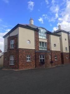 a brick building with windows on the side of it at 5 Shell Hill Mews in Coleraine