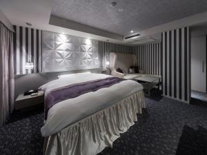 A bed or beds in a room at N Hotel