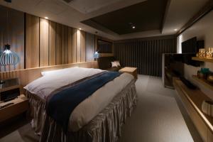A bed or beds in a room at N Hotel